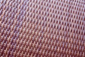 Synthetic rattan texture weaving background as used on outdoor garden furniture. photo