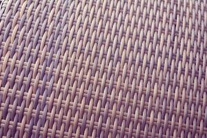 Synthetic rattan texture weaving background as used on outdoor garden furniture. photo