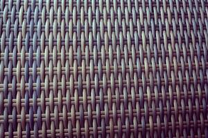 Synthetic rattan texture weaving background as used on outdoor garden furniture. photo