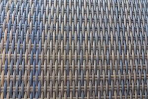 Synthetic rattan texture weaving background as used on outdoor photo