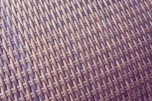 Synthetic rattan texture weaving background as used on outdoor garden furniture. photo