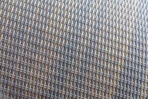 Synthetic rattan texture weaving background as used on outdoor garden furniture. photo