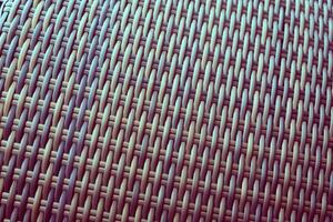 Synthetic rattan texture weaving background as used on outdoor garden furniture. photo