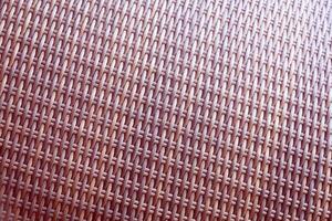 Synthetic rattan texture weaving background as used on outdoor garden furniture. photo