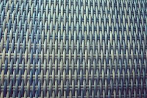 Synthetic rattan texture weaving background as used on outdoor photo