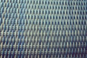 Synthetic rattan texture weaving background as used on outdoor garden furniture. photo