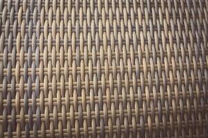 Synthetic rattan texture weaving background as used on outdoor garden furniture. photo