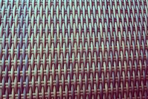 Synthetic rattan texture weaving background as used on outdoor garden furniture. photo