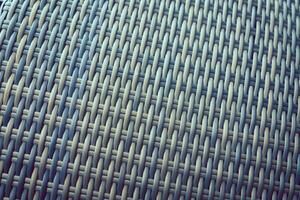 Synthetic rattan texture weaving background as used on outdoor garden furniture. photo