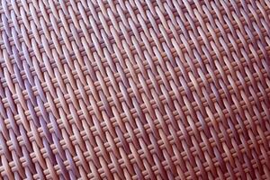 Synthetic rattan texture weaving background as used on outdoor garden furniture. photo