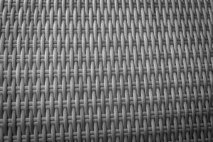 Synthetic rattan texture weaving background as used on outdoor garden furniture. photo