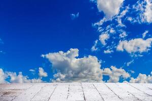 Dramatic cloudscape sky in summer day with cement floor photo