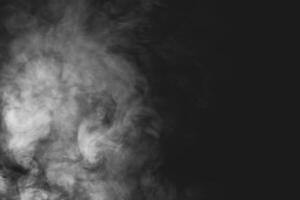 White smoke isolated on black background photo