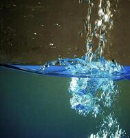 Fresh water with waves and bubbles photo