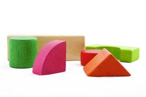 Wooden toy blocks on white background photo