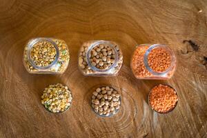 Raw cereals set on wooden background photo