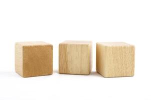 Wooden toy blocks on white background photo