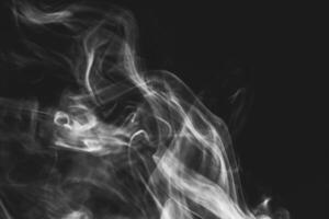 White smoke isolated on black background photo