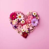 Pink heart made of flowers. Heart shape made of spring flowers on pink pastel background. AI Generated photo