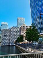 Low Angle View of Canary Wharf Buildings at Central London City of England Great Britain. The Footage Was Captured on 08-June-2023 During Clear Day. photo