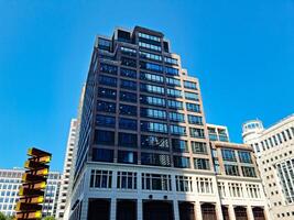 Low Angle View of Canary Wharf Buildings at Central London City of England Great Britain. The Footage Was Captured on 08-June-2023 During Clear Day. photo