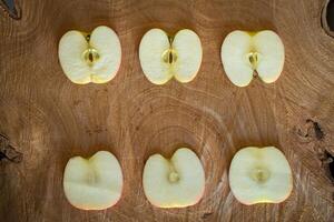 Fresh red apples on a wooden background photo