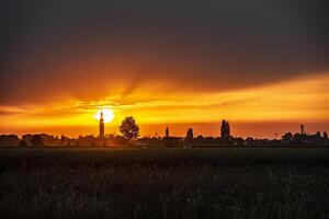 Sunset bell tower trees countryside summer photo