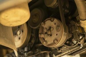 Pulleys and belts on the car engine photo