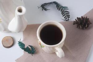 Sweet tea with a white cup and teapot with ceramic material photo