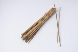 Some skewers made of bamboo are often used by Indonesians to make goat satay photo