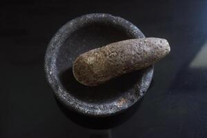 Stone mortar and stone grinder from Indonesia called Layah, Ulegan or Cobek photo