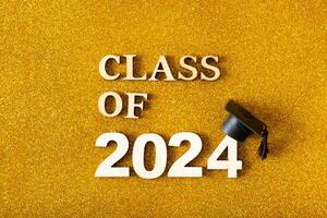 Class of 2024 text with graduated cap. Graduation holiday concept. photo