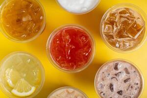 Colourful summer drinks with ice. Lemonades and coctails top view photo