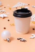 Banner with coffee beans and Christmas decorations flat lay, top view on trendy 2024 Peach Fuzz color background. photo