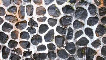 Texture of a stone wall. Old castle stone wall texture background. Stone wall as a background or texture. photo