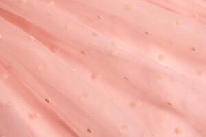 Gentle texture background soft pink color, textile pattern, pink polka dot on tulle, copy space photo