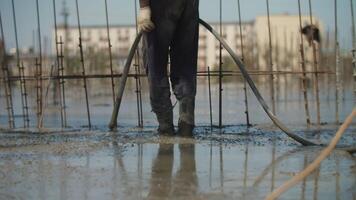 Vibration work with liquid concrete at the construction site video