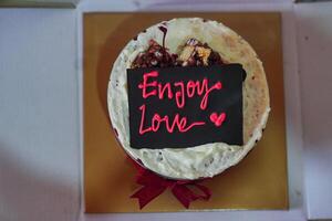 red velvet cake with enjoy love text decoration photo