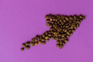 coffee seeds laid out in the form of an arrow photo