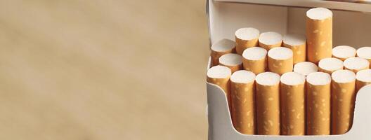 peel it off Cigarette pack prepare smoking on white wooden background. Packing line up. photo filters Natural light