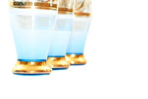 Blue gold festive glasses for wine, juice, drinks,beverages photo