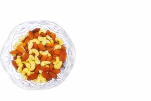 Crystal vase bowl with healthy nutritious nuts almond, cashew photo