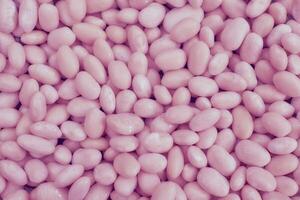 Pink abstract beans, sweet candies, pebbles, backdrop photo