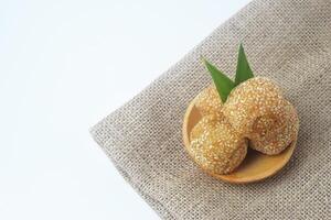 A typical Indonesian snack often called onde onde on a white background photo