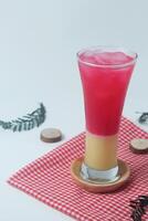 Close up photo of red soda mixed with milk is called Soda Susu or Soda Gembira