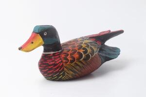 An Indonesian duck toy made of wood and painted in an attractive color photo