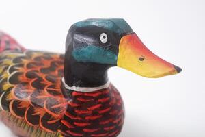 Close up photo of a typical Indonesian toy duck made of wood and painted colors