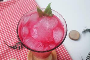 Close up photo of red soda mixed with milk is called Soda Susu or Soda Gembira