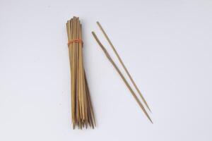 Some skewers made of bamboo are often used by Indonesians to make goat satay photo