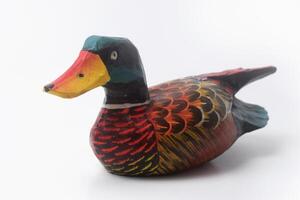 Close up photo of a typical Indonesian toy duck made of wood and painted colors